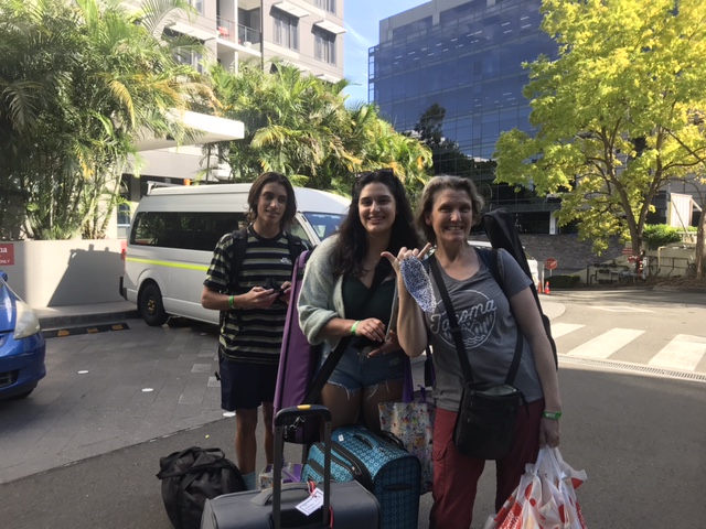 family outside hotel