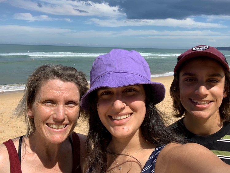 woman and kids at beach