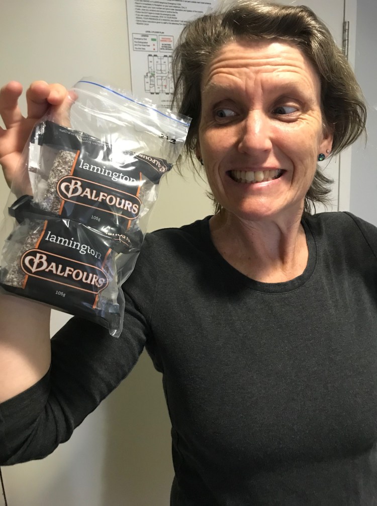 woman holding lamingtons